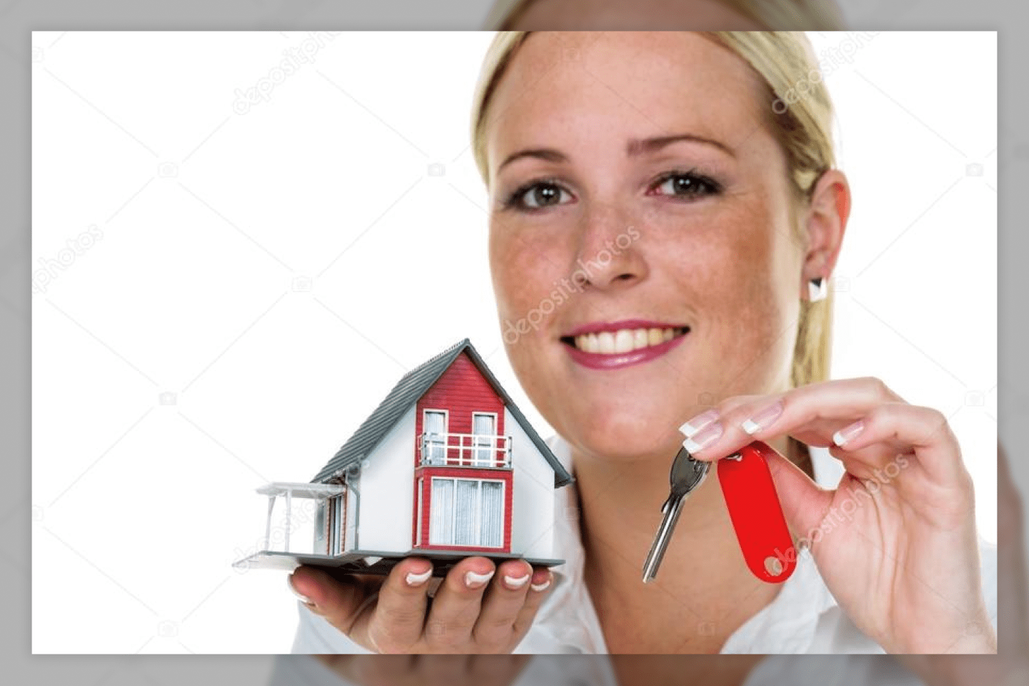 29 smiling woman holding two model homes 209
