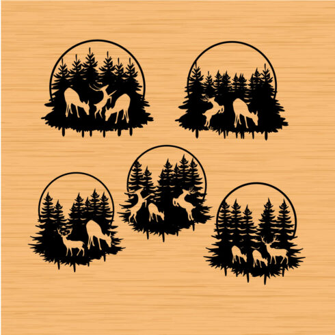 Set of four wood stamps depicting deer and trees.