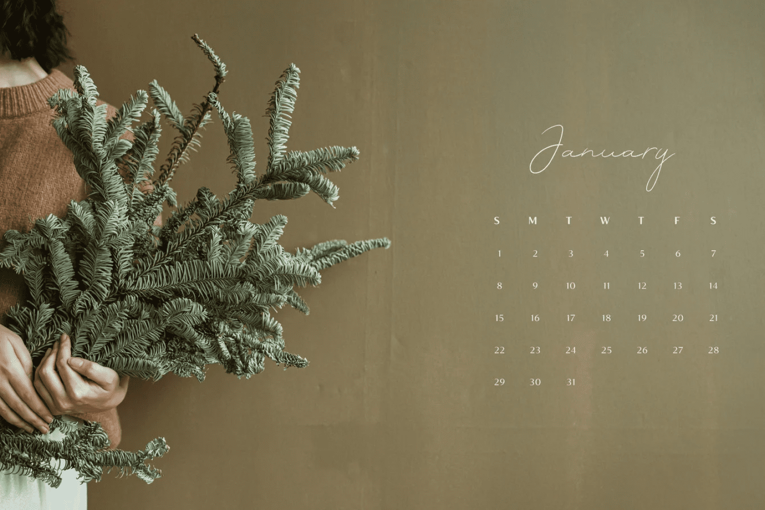 Calendar for january with a photo of a girl holding a bunch of fir branches.