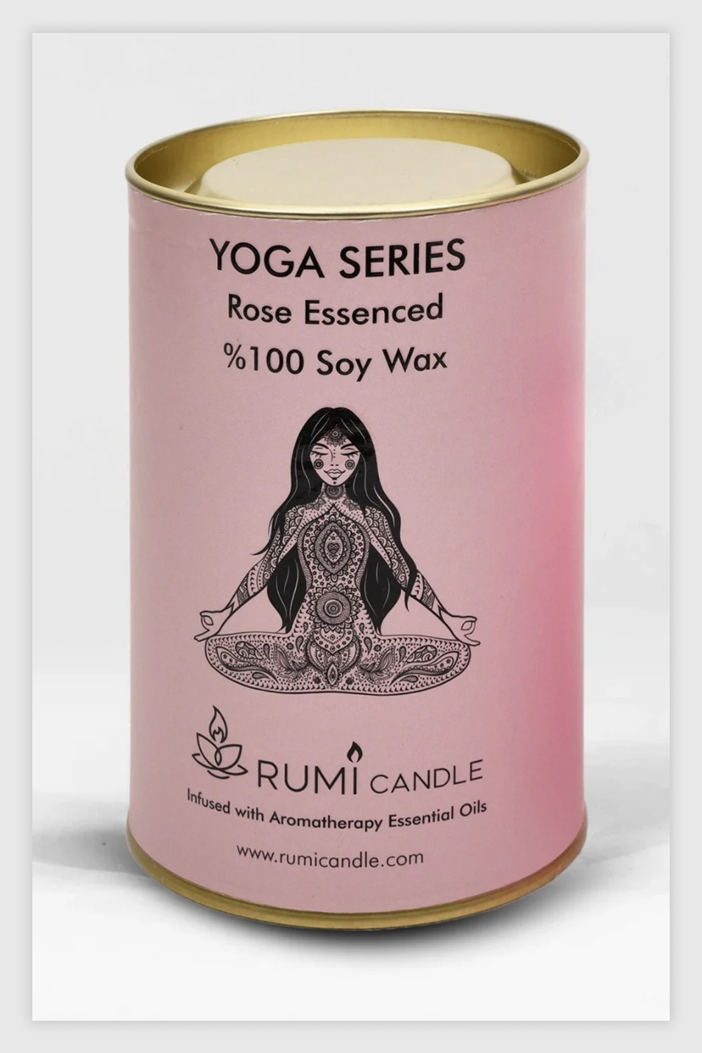 Stylish candle with woman in yoga pose printed on it.