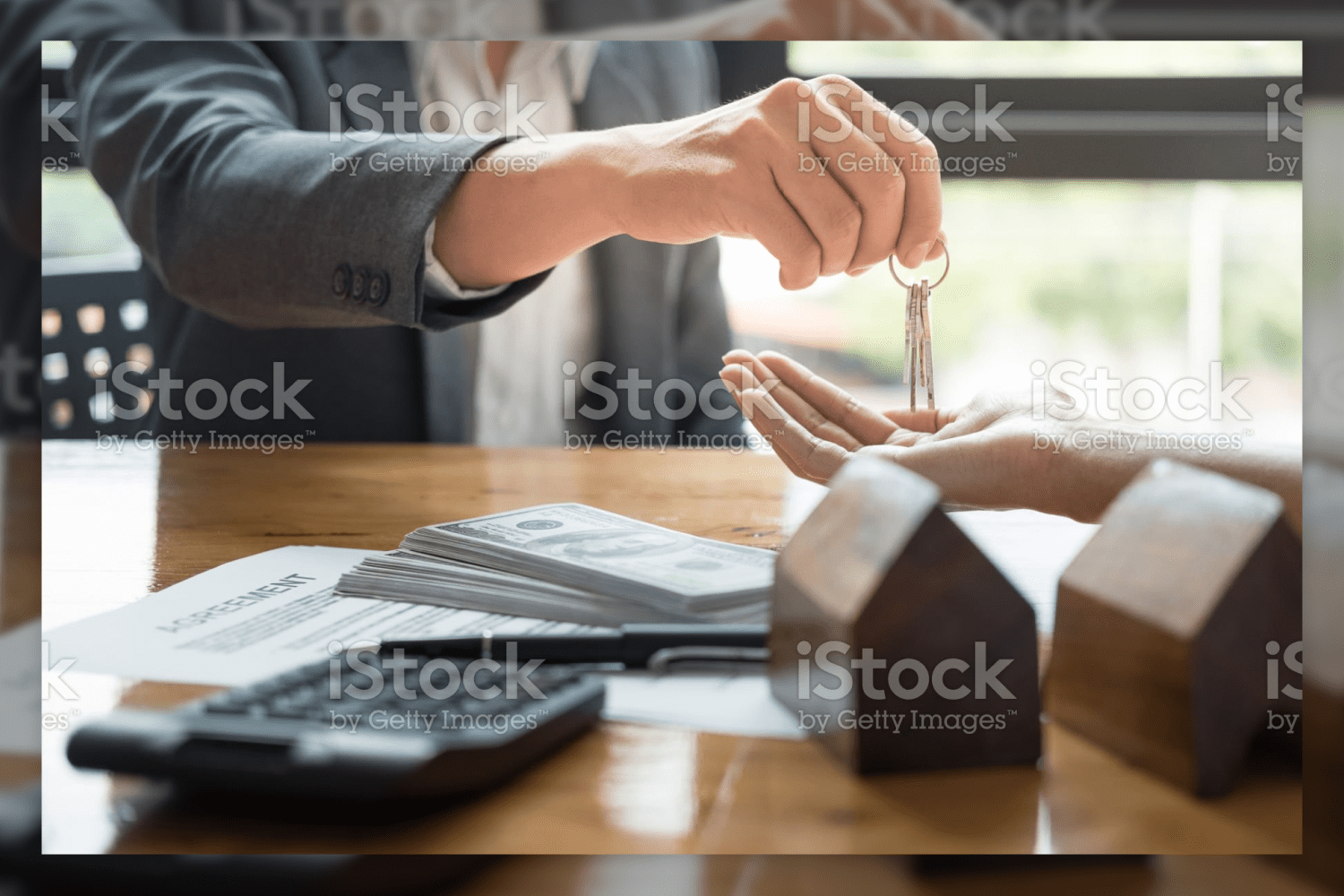 38 estate agent giving house keys to man in the office 505