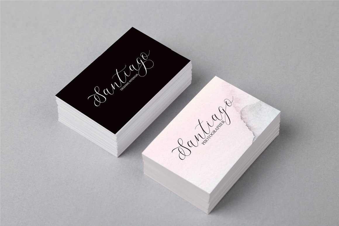 A lot of black and white visiting cards with white and black lettering "Santiago".