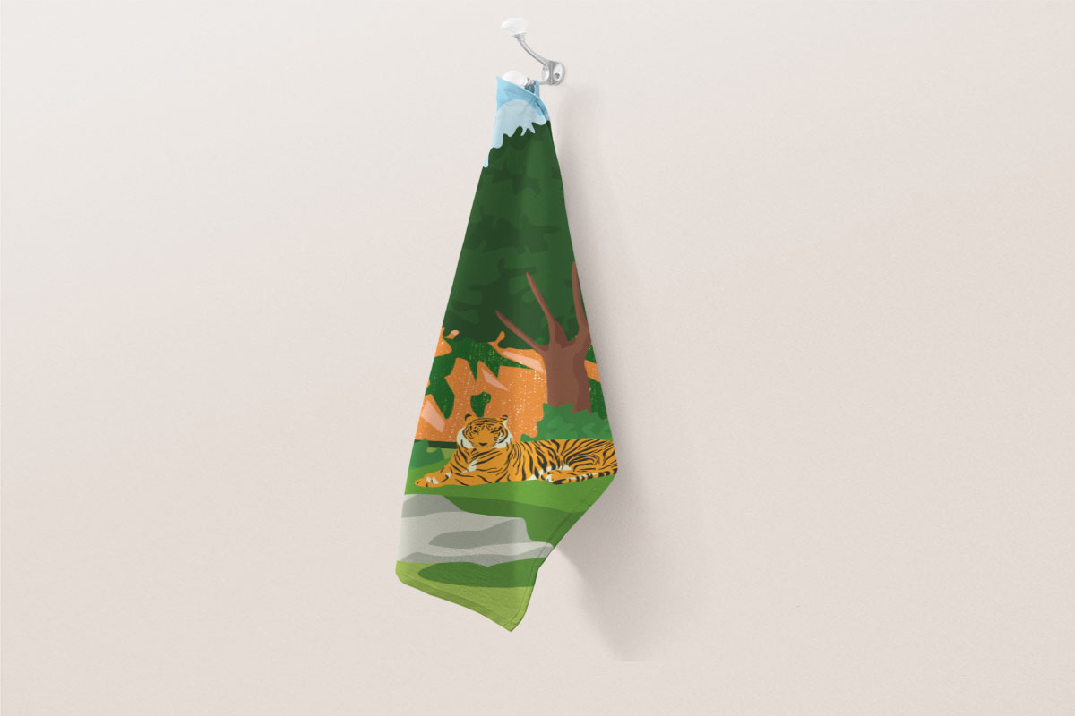 Some fabric with colorful forest illustration.