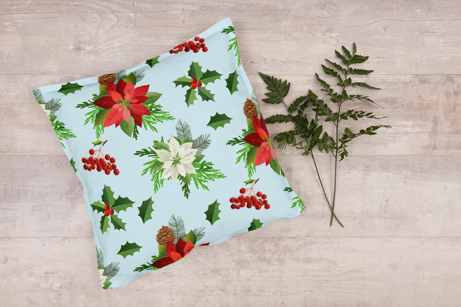 Light turquoise pillow with flowers.