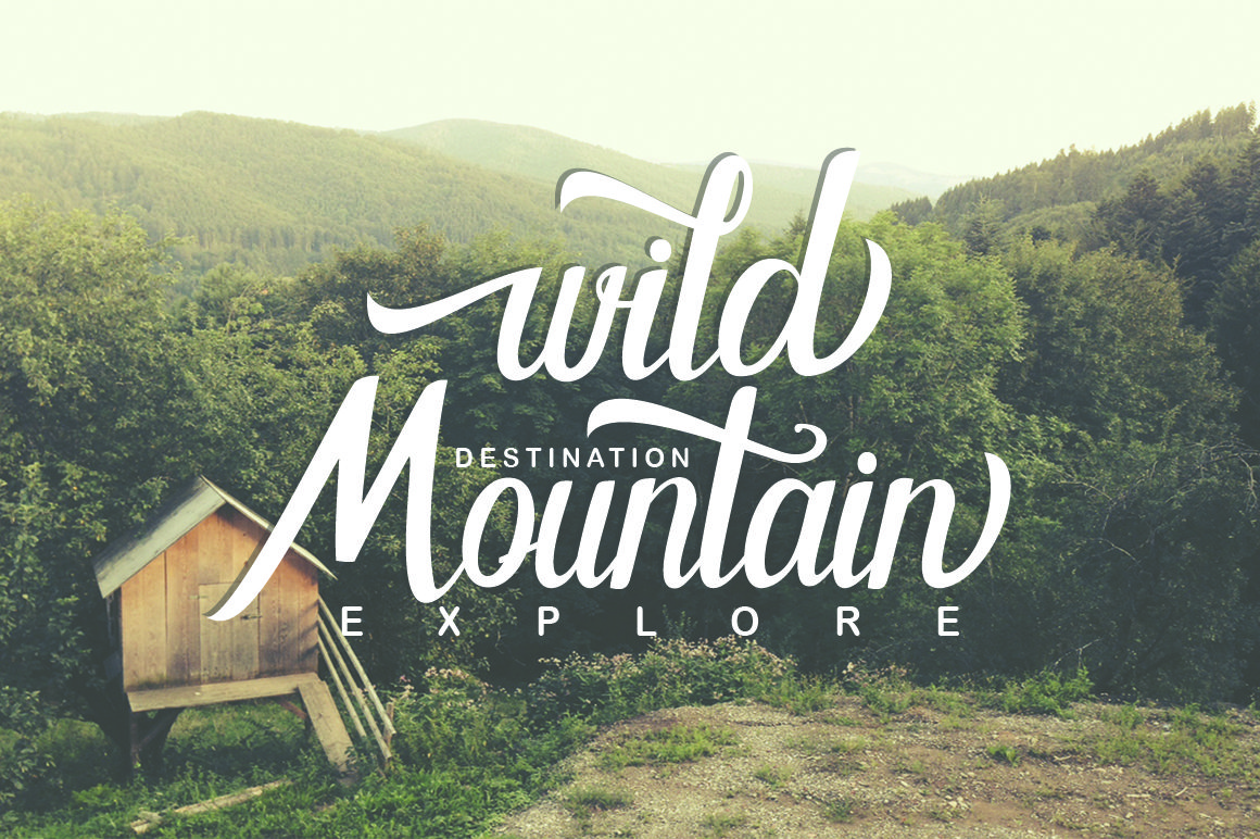 White lettering "Wild Mountain" on the image of mountains.