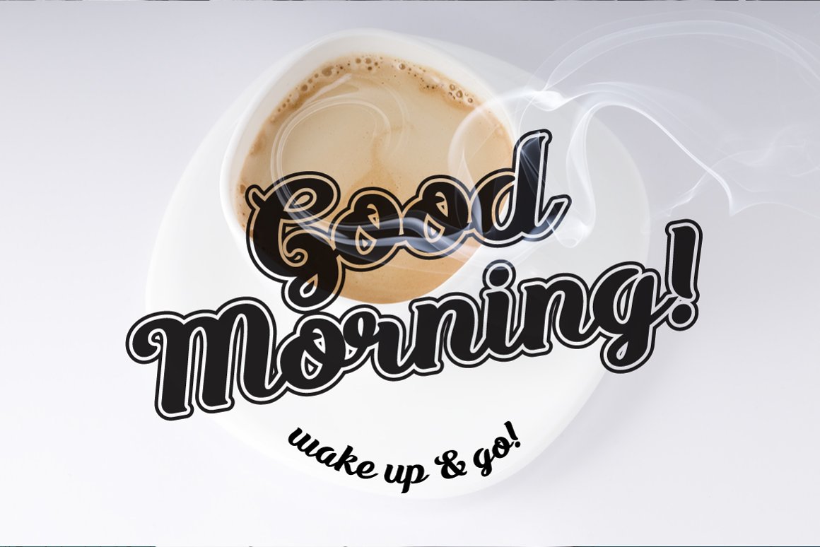 Black lettering "Good morning!" in script font on the background of cup of coffee.