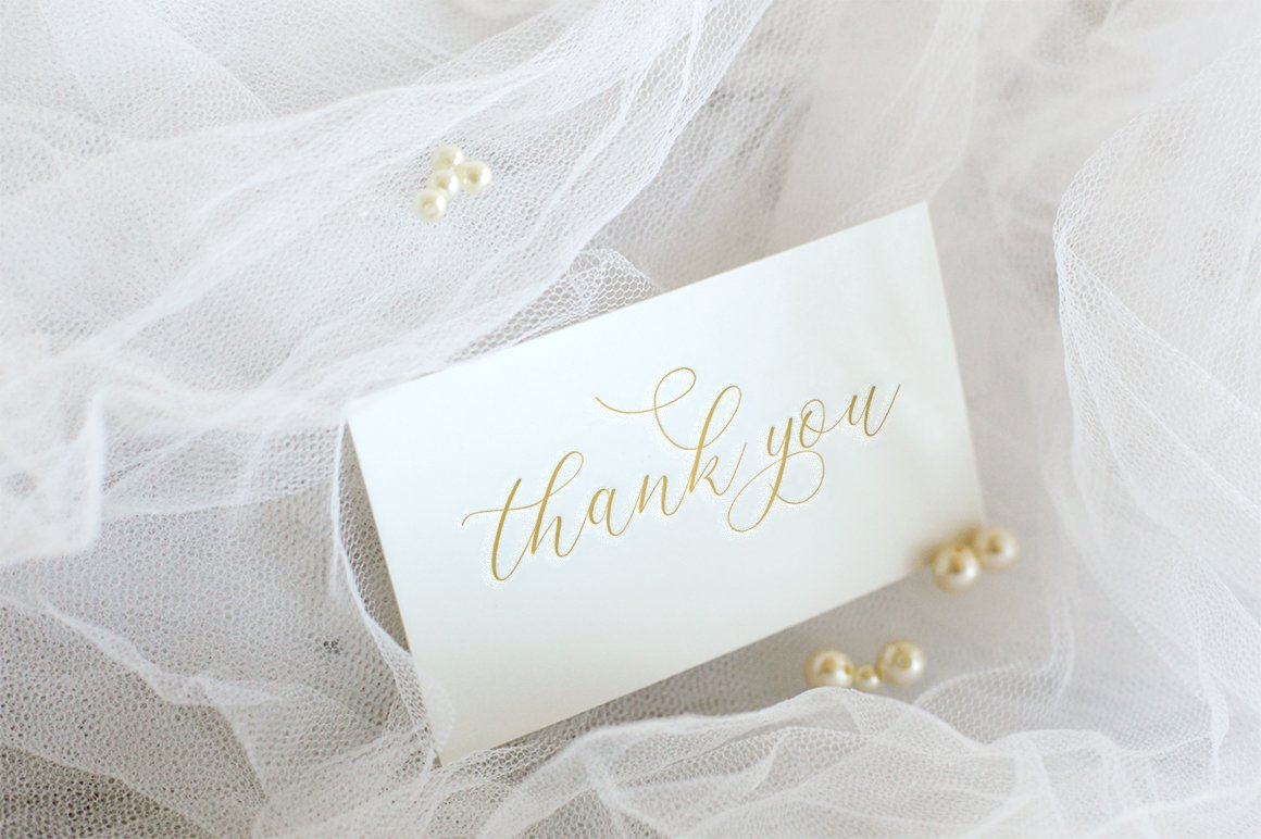 White card with golden lettering "Thank you".
