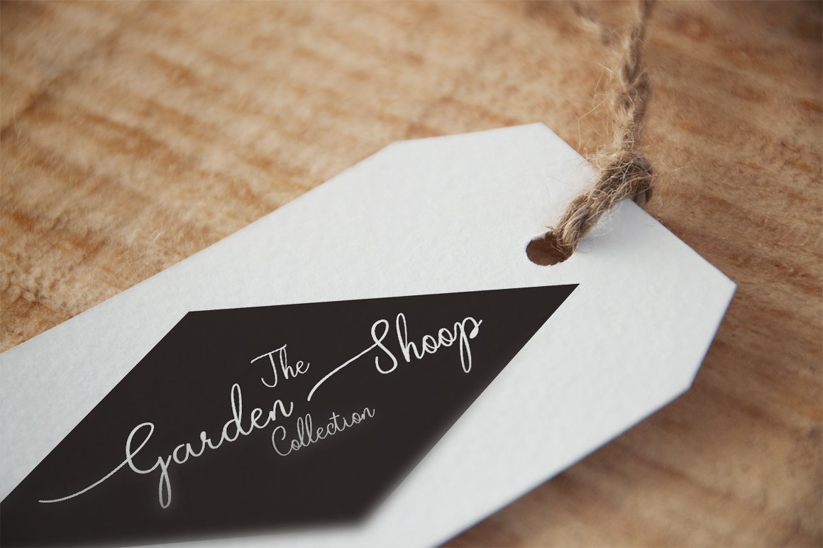 White and black label with white lettering "The garden shop".