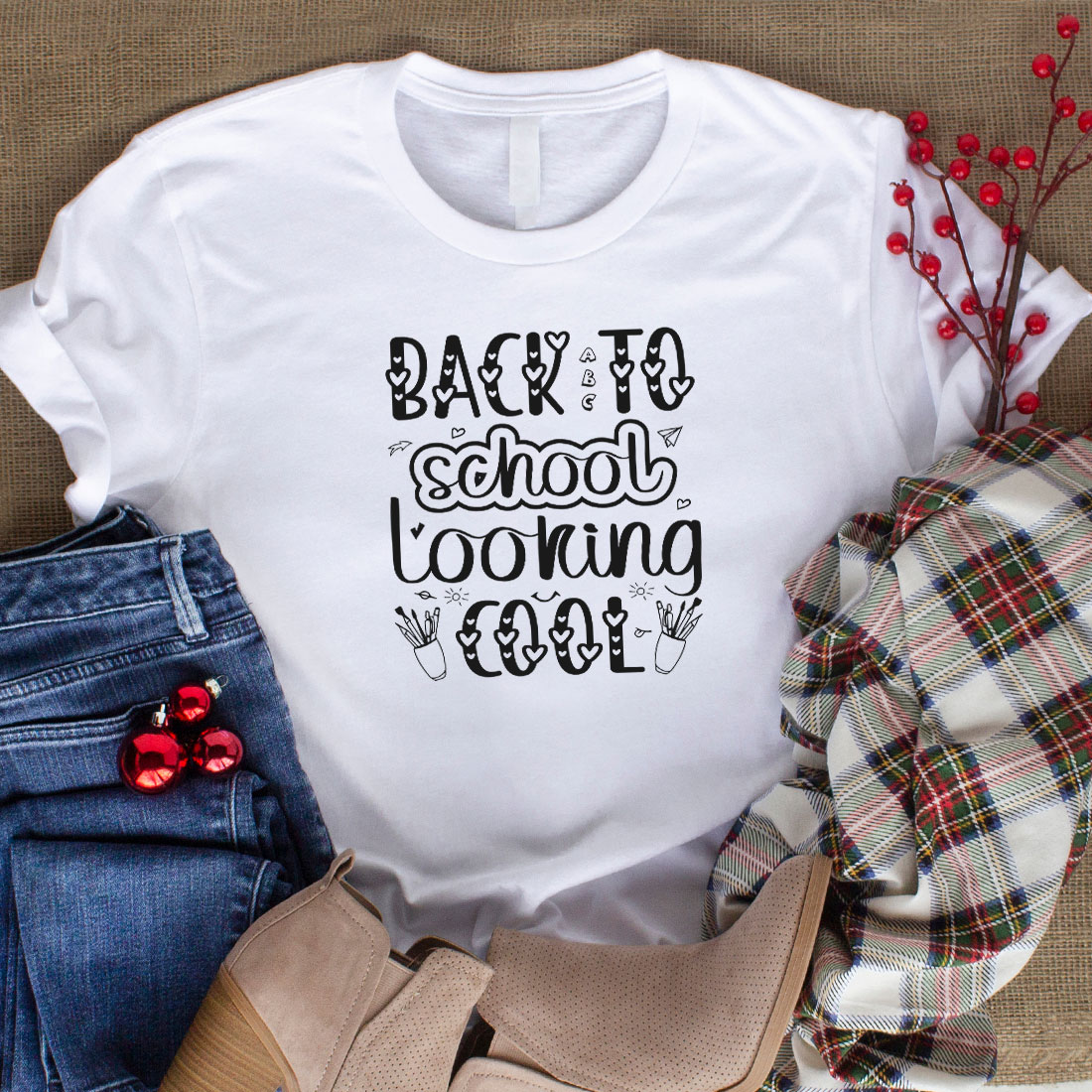 Image of a white t-shirt with a charming slogan Back to school looking cool