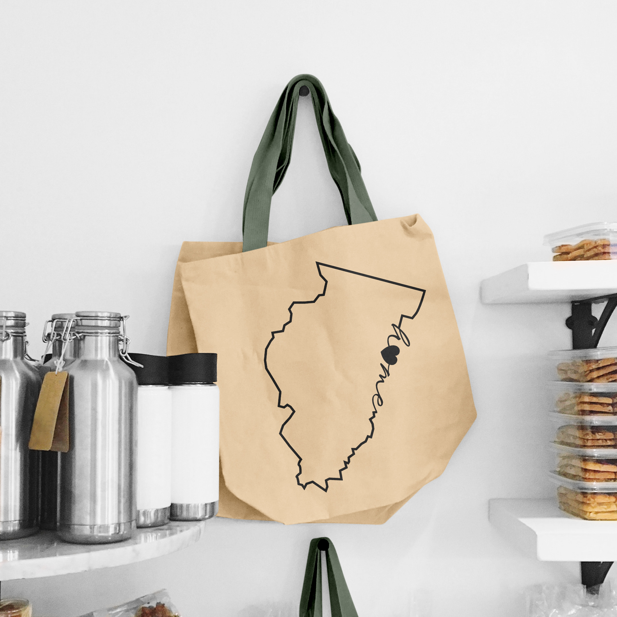 Black illustration of map of Llinois on the beige shopping bag with dirty green handle.