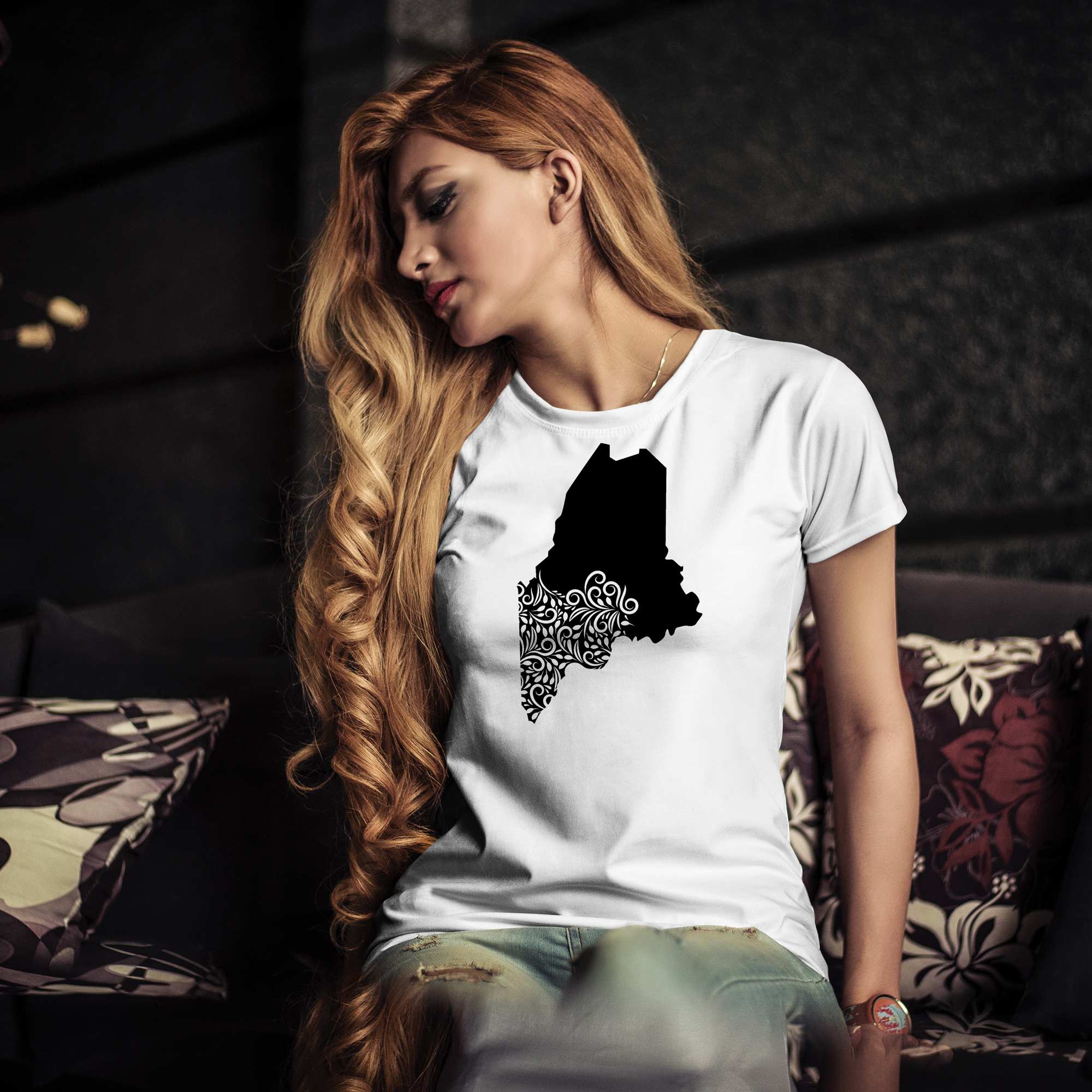White t-shirt with black illustration of Maine state.