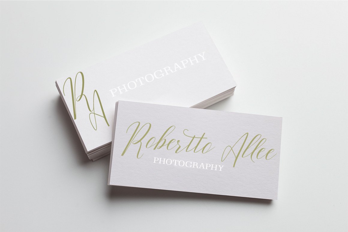 A lot of white visiting cards with golden lettering.
