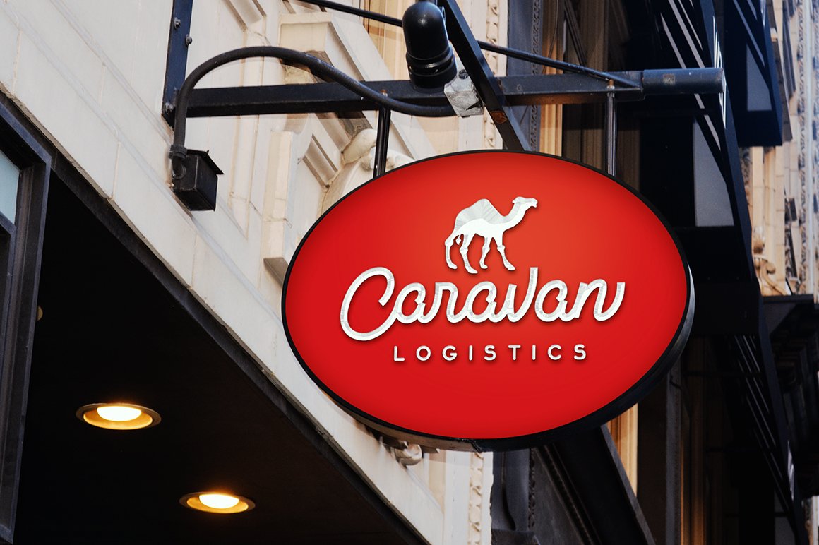 Red signboard with white lettering "Caravan" and illustration of camel.