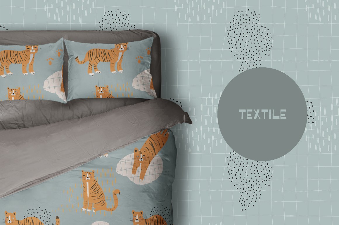 Gray and dirty blue bedclothes with patterns of wild animals on a dirty blue background.