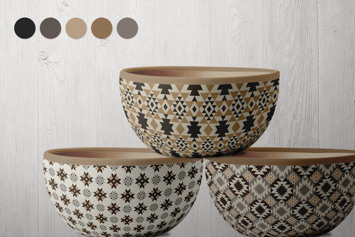 3 bowls with earthy aztec pattern on a wooden background.