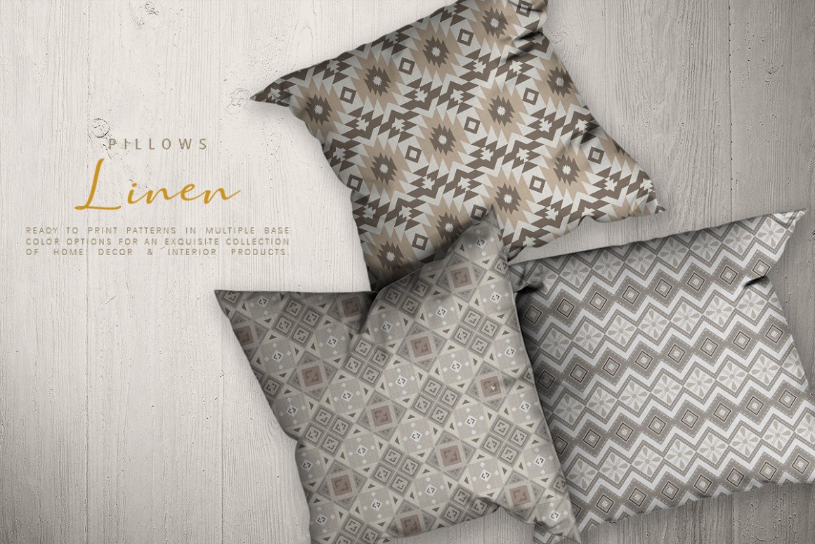 3 pillows with earthy aztec patterns on a wooden background.