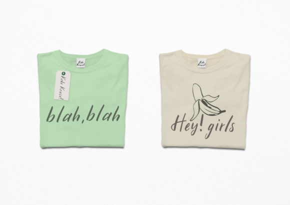 Dirty green and beige t-shirts with dark gray lettering on a gray background.