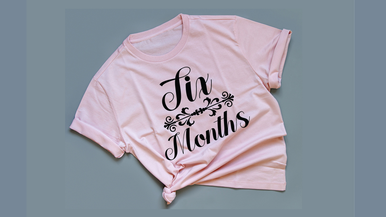 Light pink t-shirt with lettering.