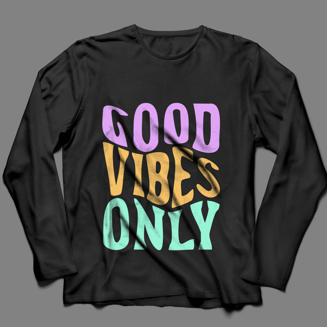 Picture of a black sweatshirt with colorful Good Vibes Only slogan