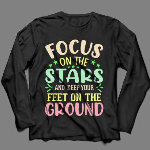 Picture of a black sweatshirt with gorgeous slogan focus on the stars and keep your feet on the ground