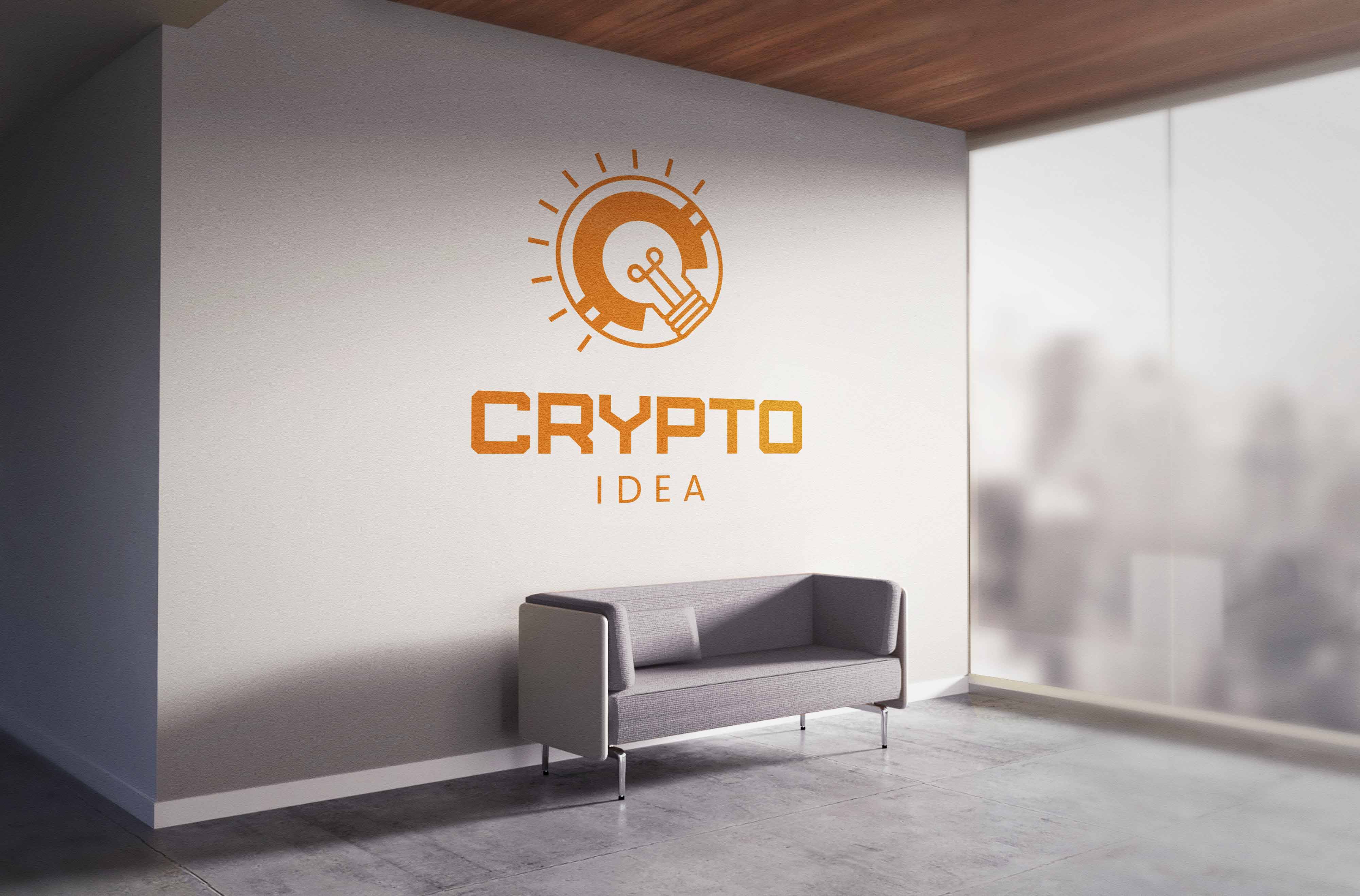 Gold crypto logo on a light wall.