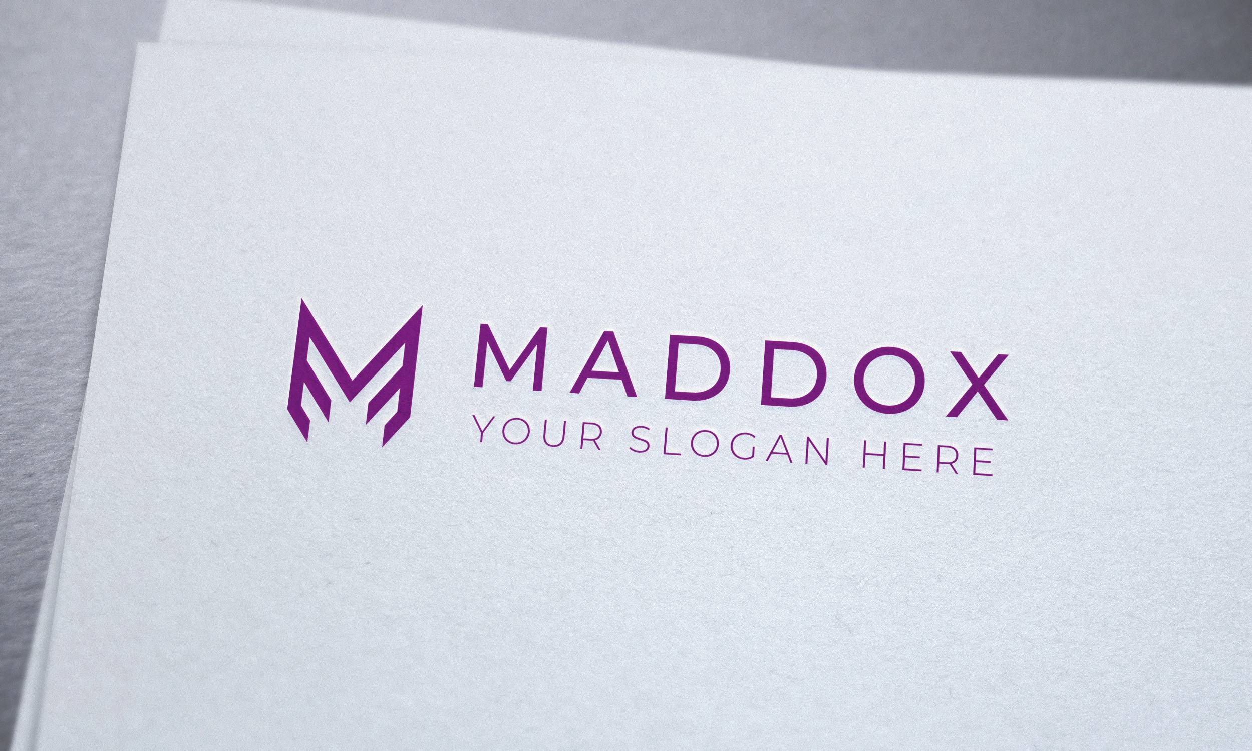 Purple letter logo on a white paper.