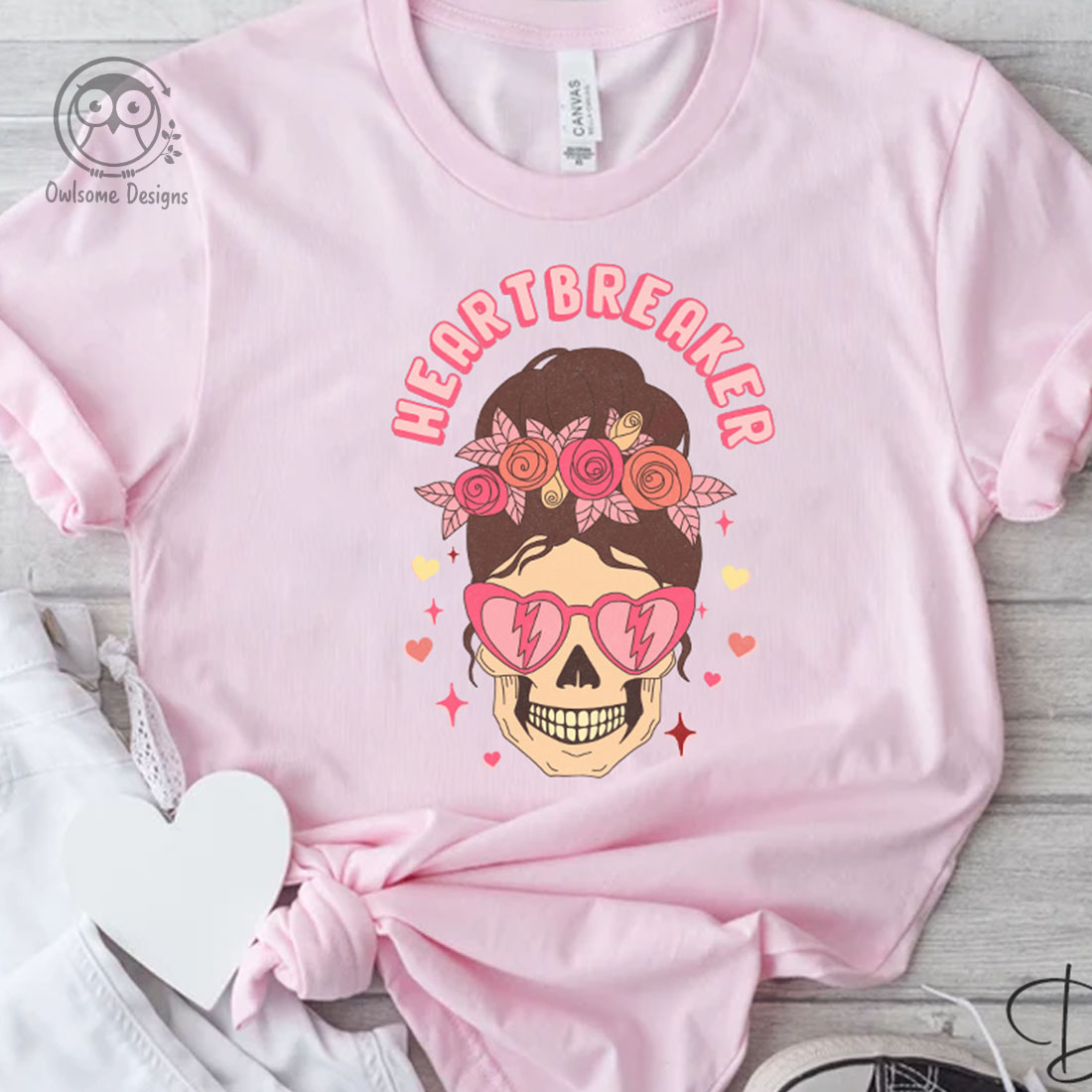 Image of t-shirt with unique print female skull in pink glasses.