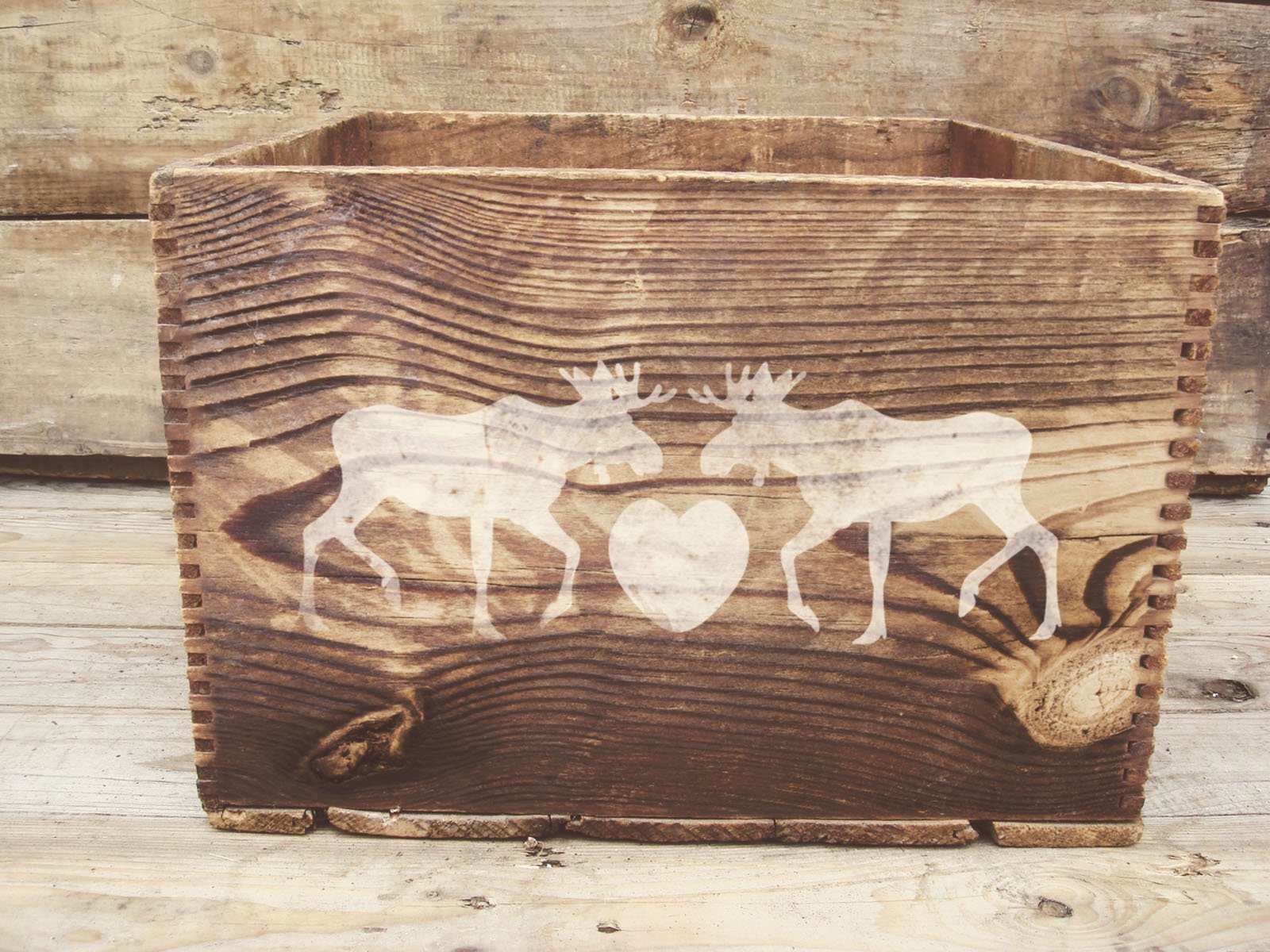 Wooden bow with deers.