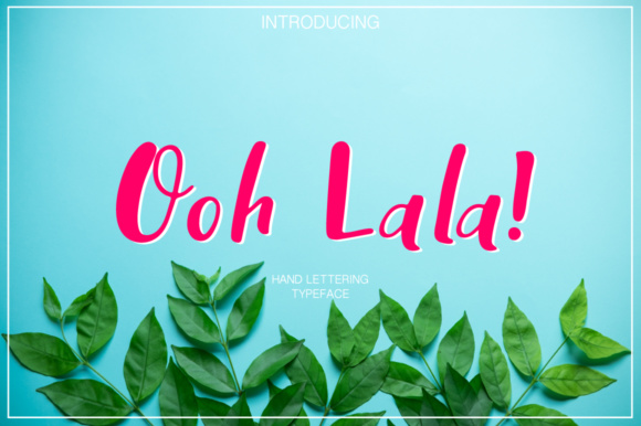 Pink lettering "Ooh Lala!" on a blue background with leaves.