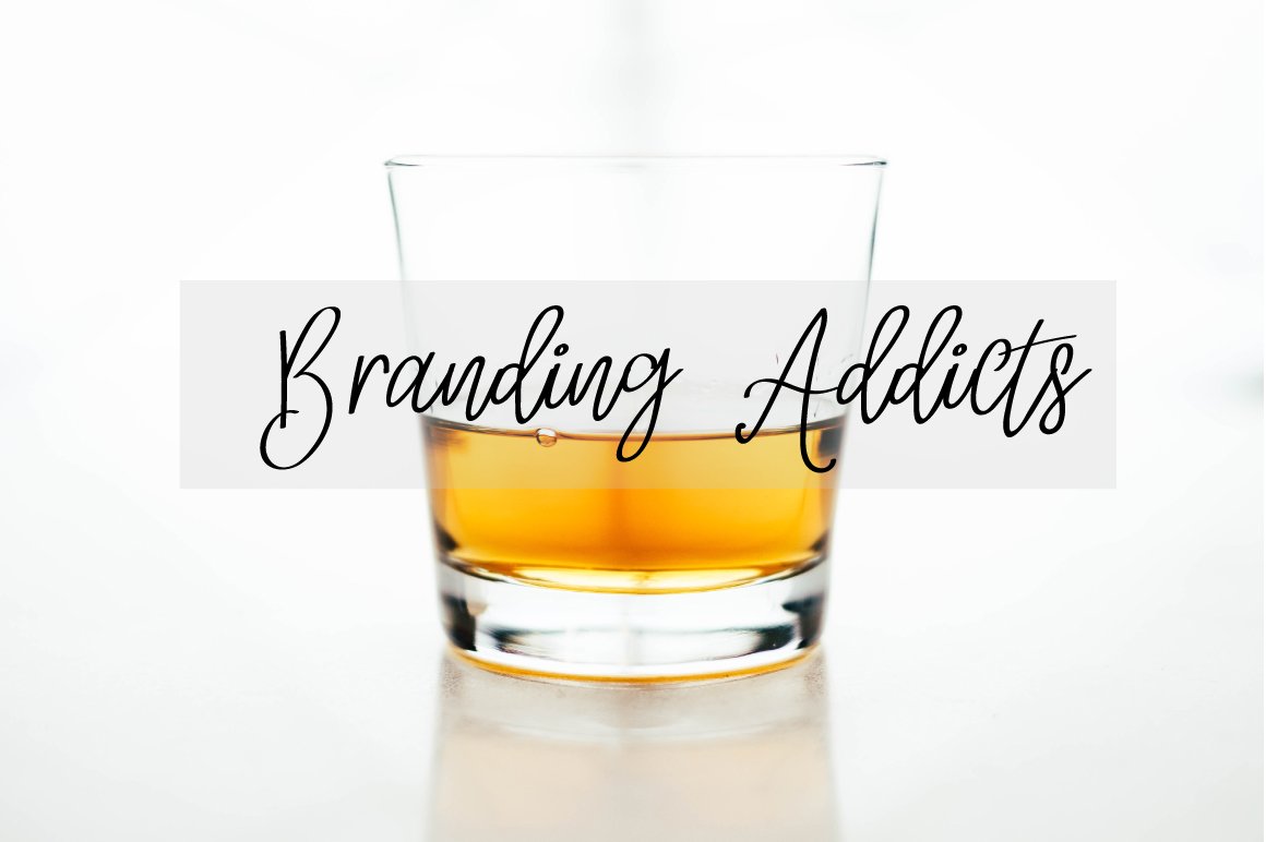 Black lettering "Branding Addicts" on the image of a cup.