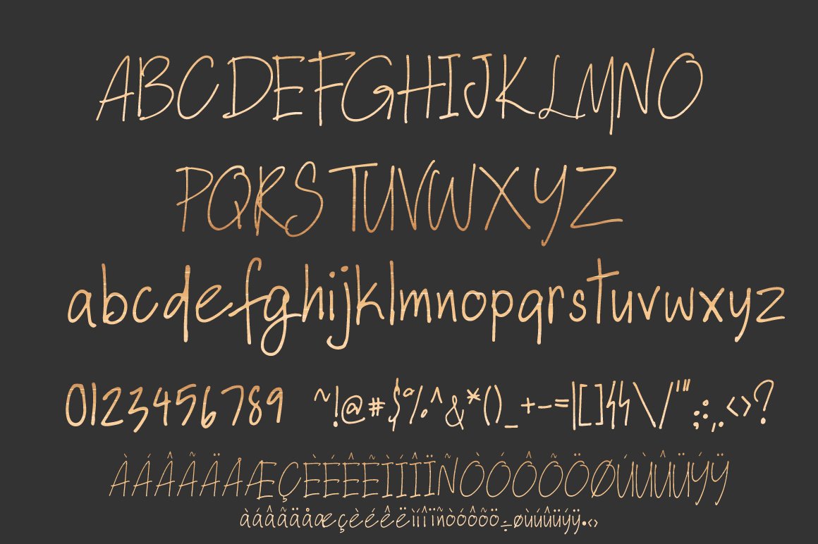 A set of golden uppercase, lowercase, numbers, fractions and punctuation on a gray background.