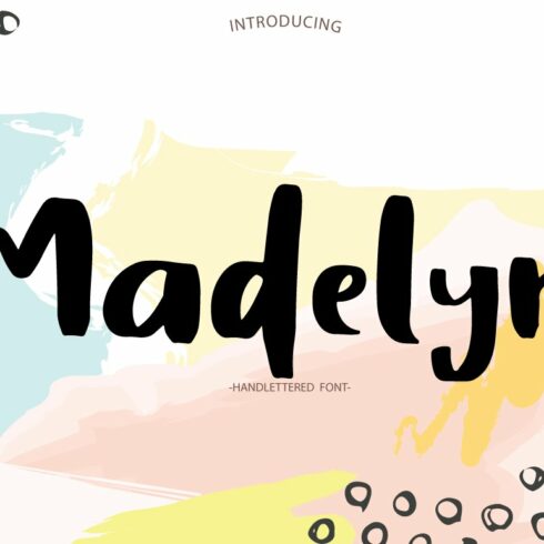 Black lettering "Madelyn" on watercolor background.