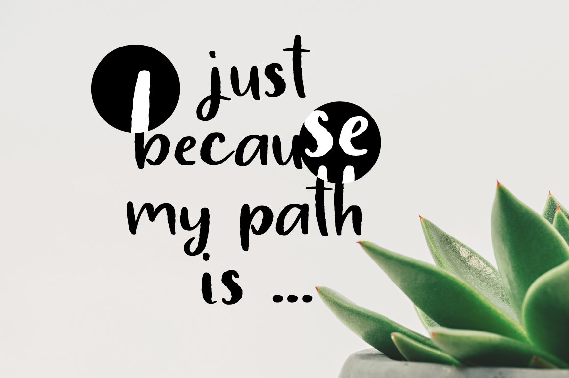 Black lettering "Just because my path is..." on a gray background.