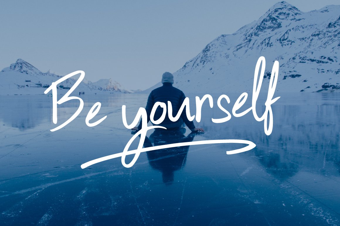 White lettering "Be yourself" on the image of man on the ice.