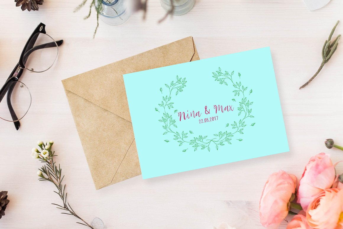 Blue wedding card with pink script lettering on the envelope.