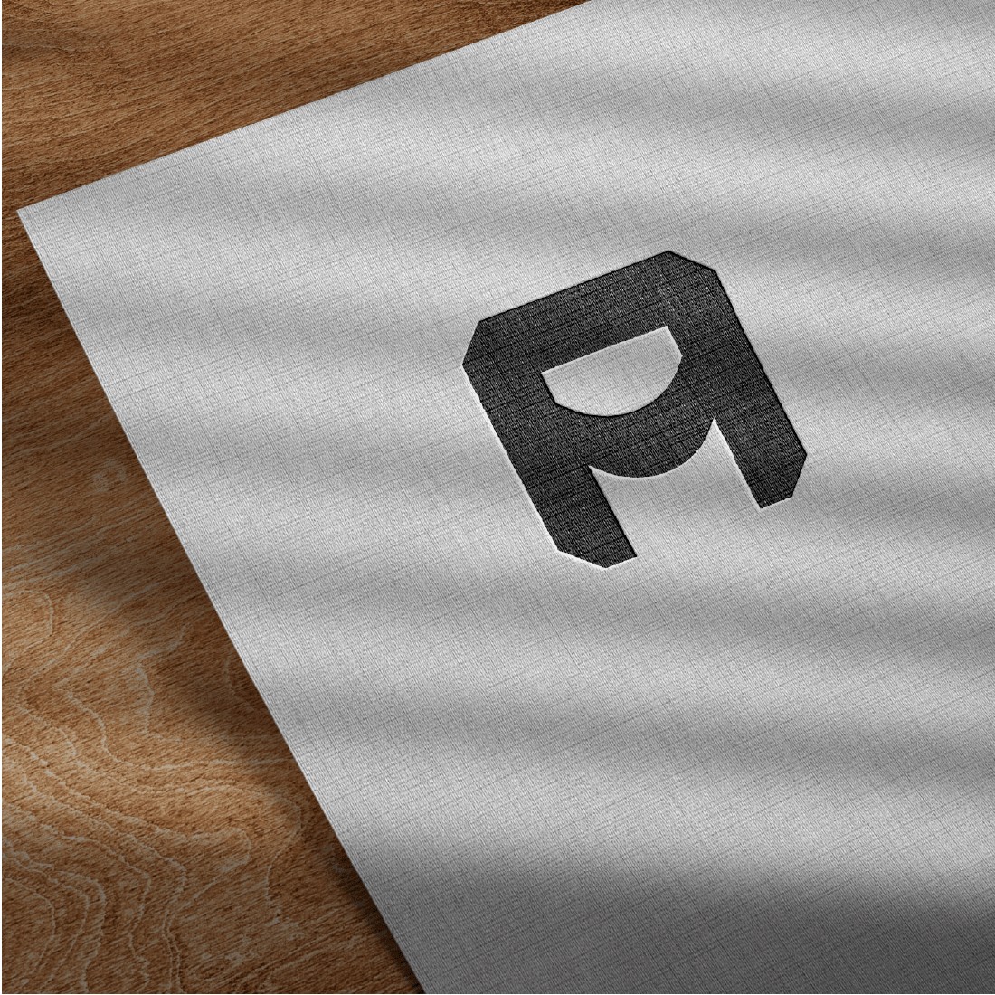 White paper with letter logo.