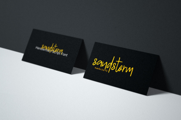 2 black visiting cards with yellow lettering "Sandstrom".