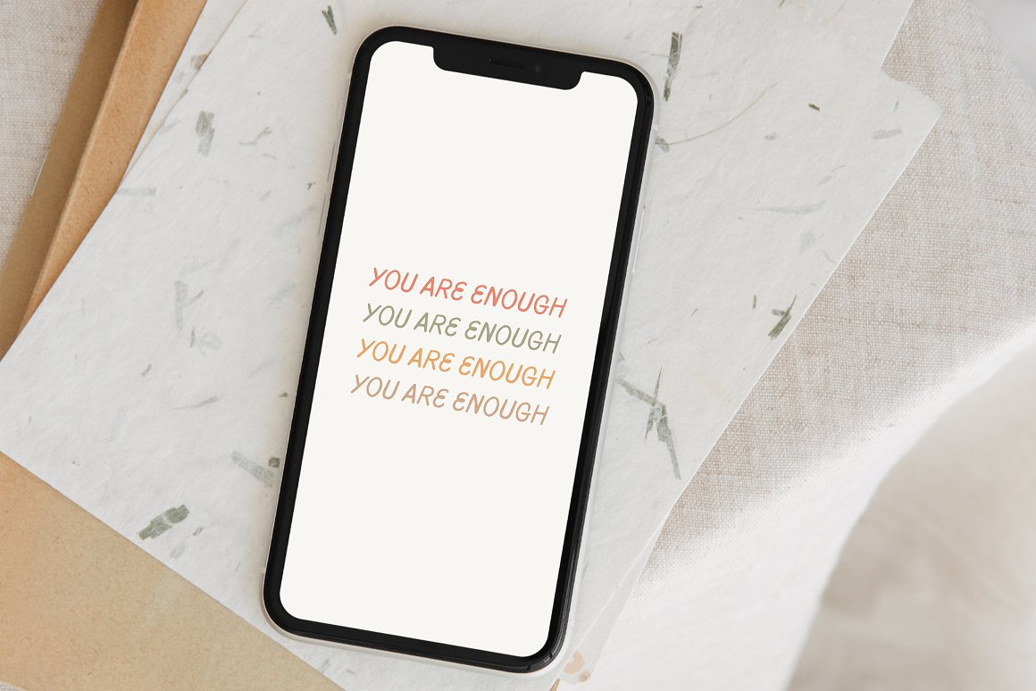 Black mockup of iphone with colorful lettering "You are enough".