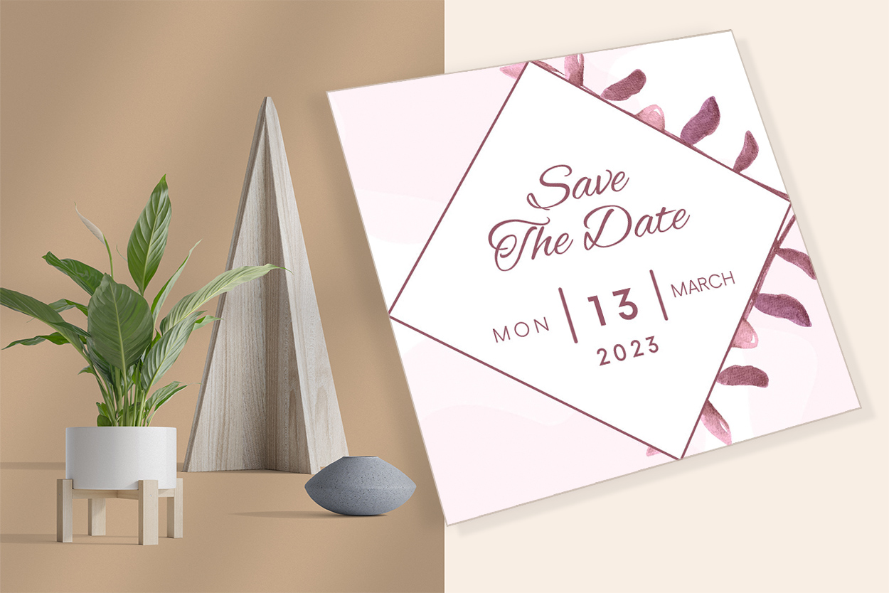 Image of an elegant wedding invitation with purple leaves.