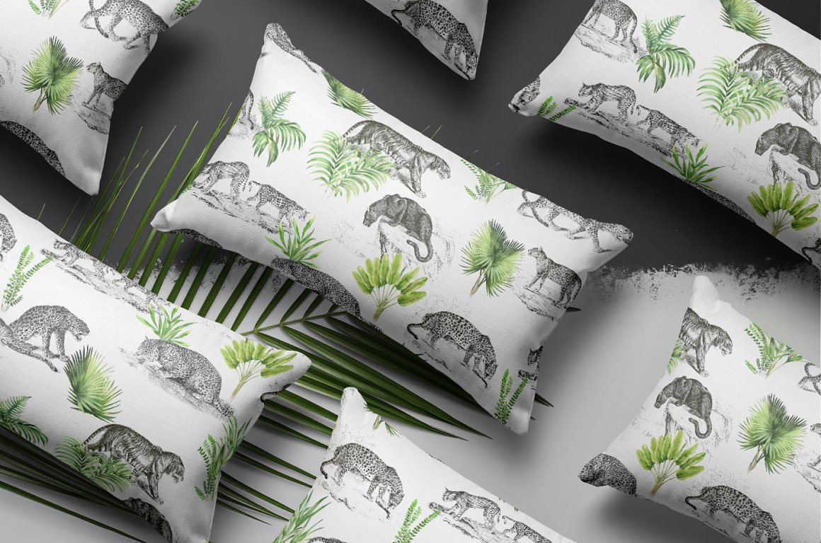 White pillows with pattern of animals on a gray and white background.