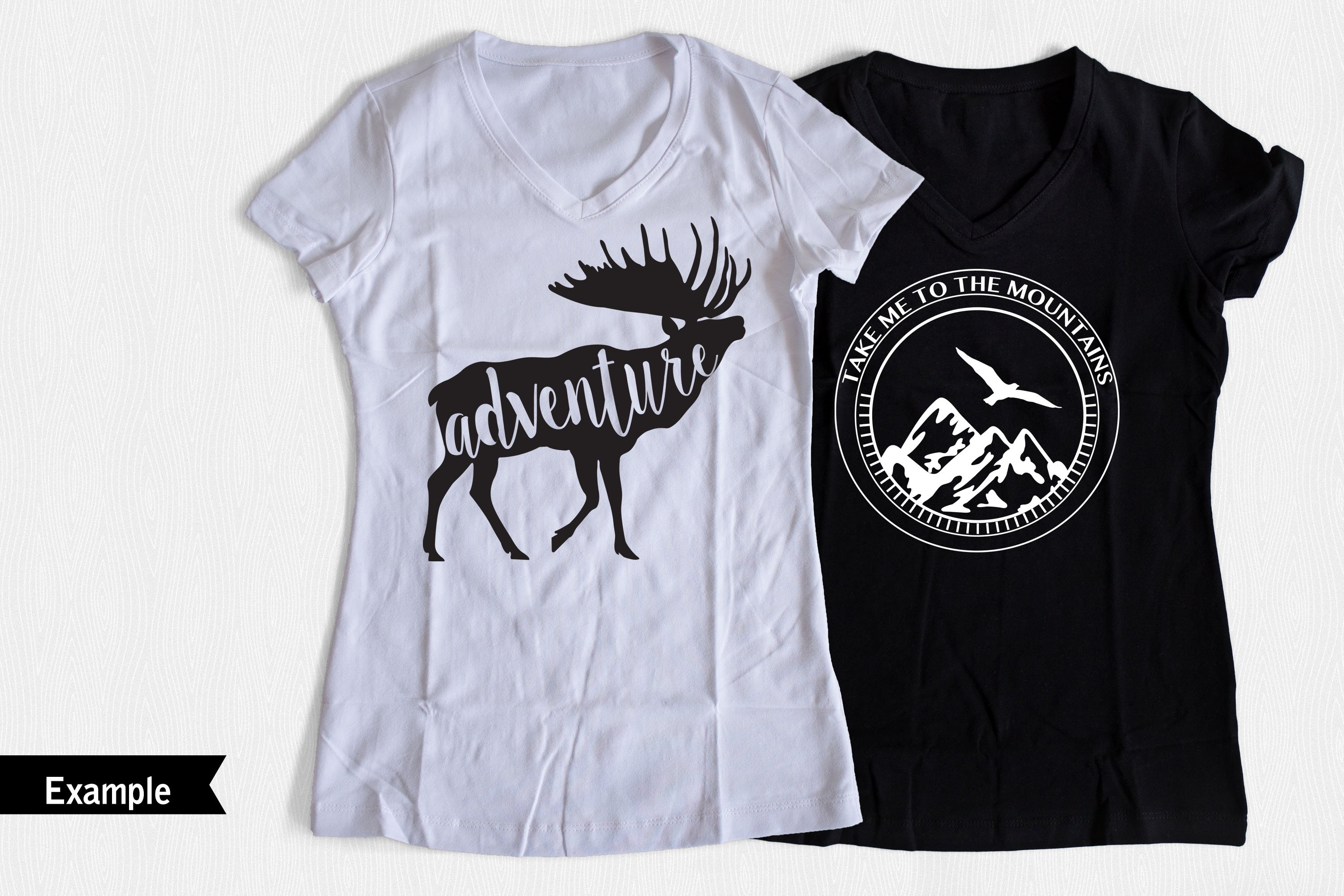 Two t-shirts - black and white - with deer graphic.