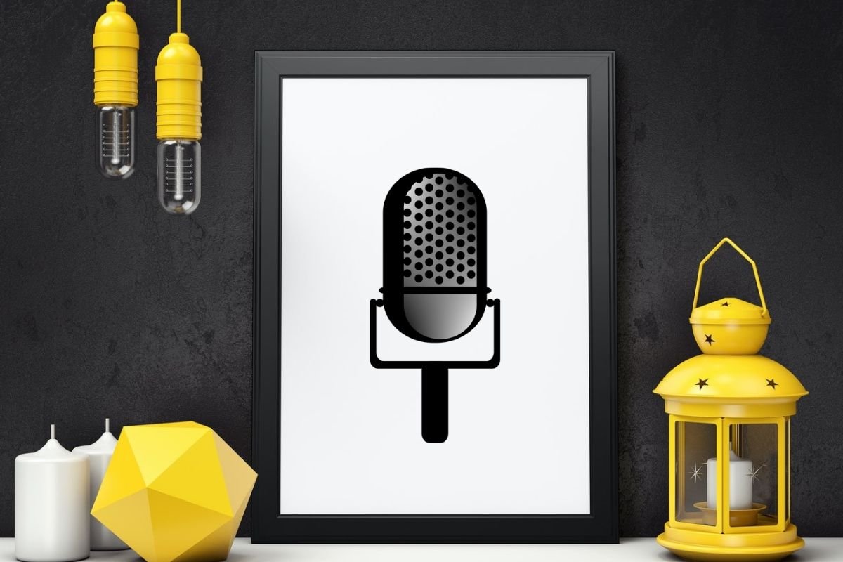 Dark wall and yellow elements of interior with the simple poster with black microphone.