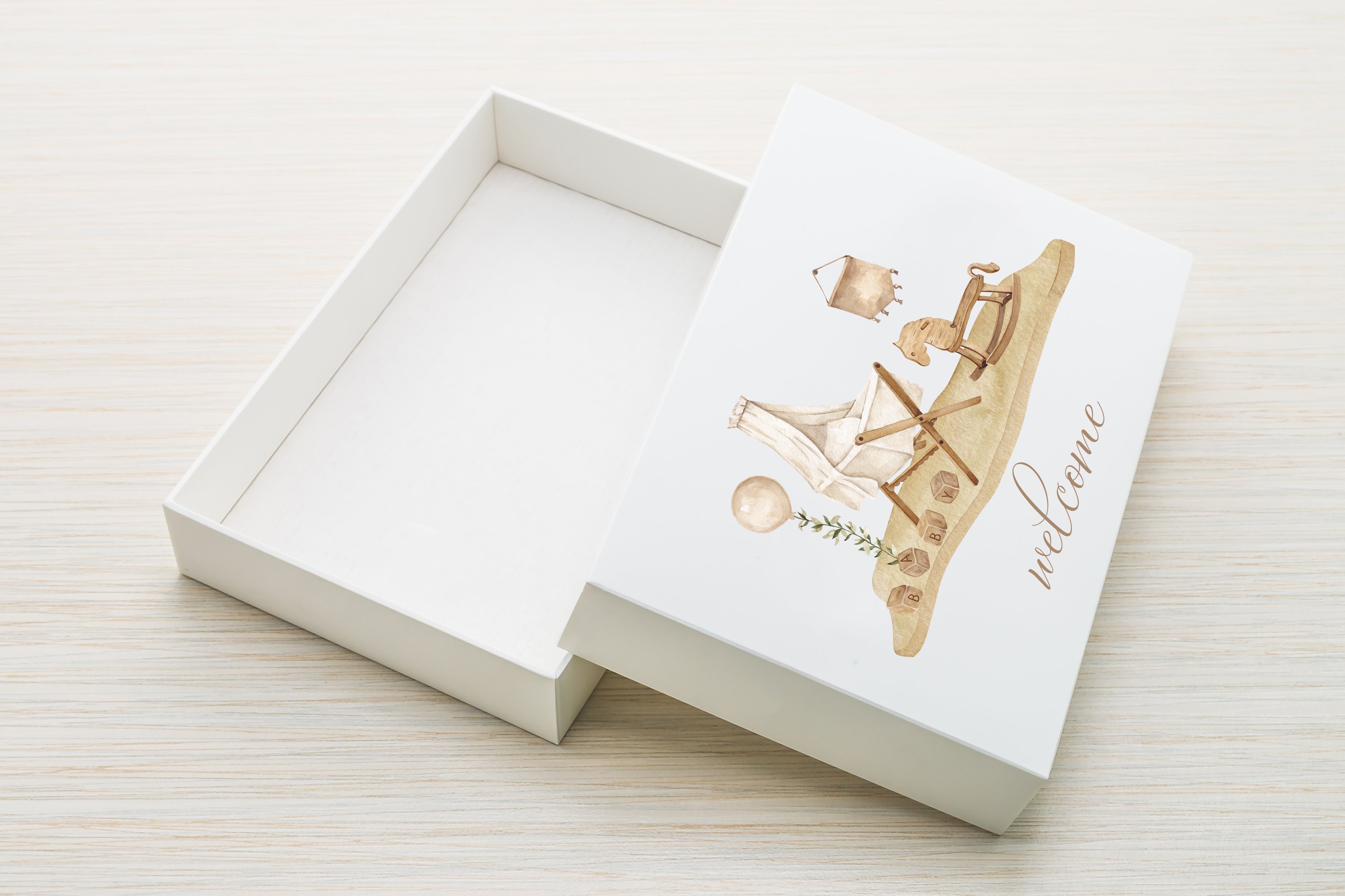 White paper box with a cradles graphic.