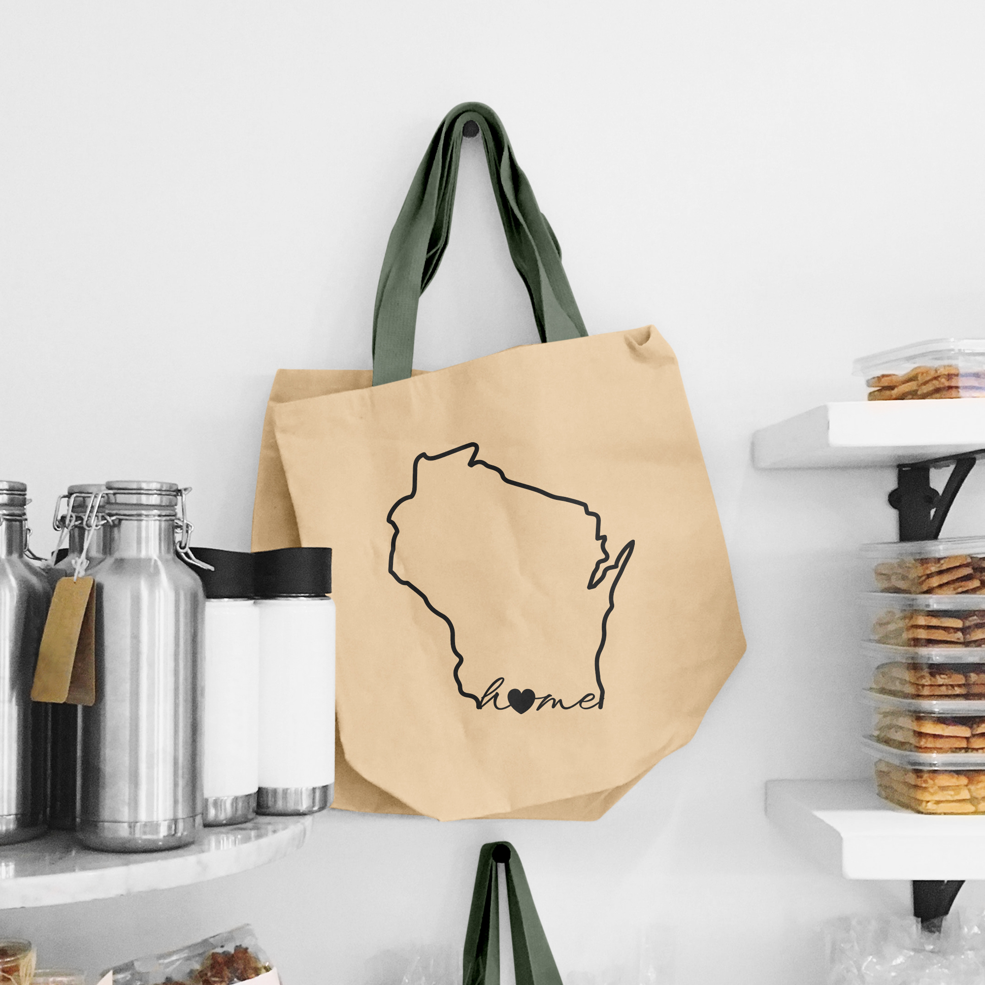 Black illustration of map of Wisconsin on the beige shopping bag with dirty green handle.