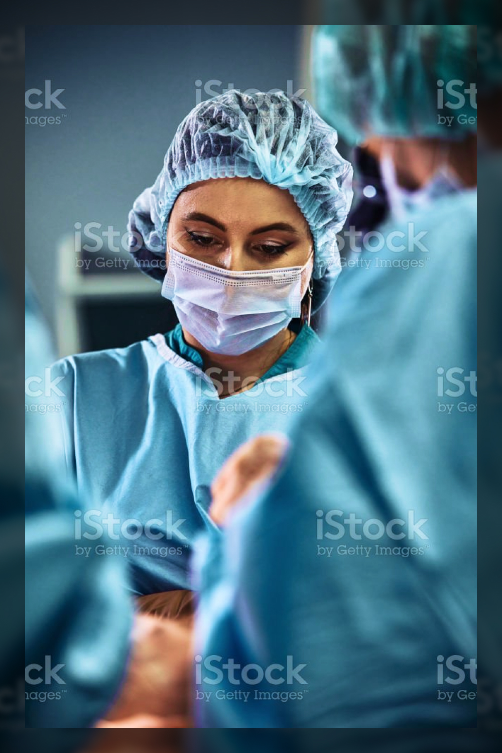In the hospital operating room. an international team of professional surgeons and assistants works in a modern operating room. 259