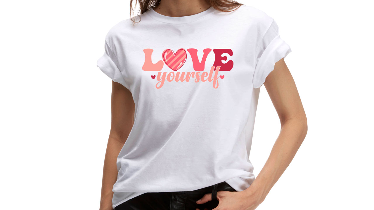 Minimalistic love lettering on a white t-shirt.