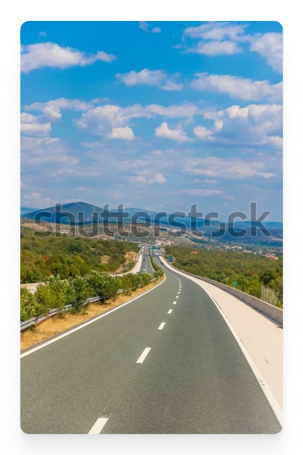 Photo of an asphalt road among the hills.