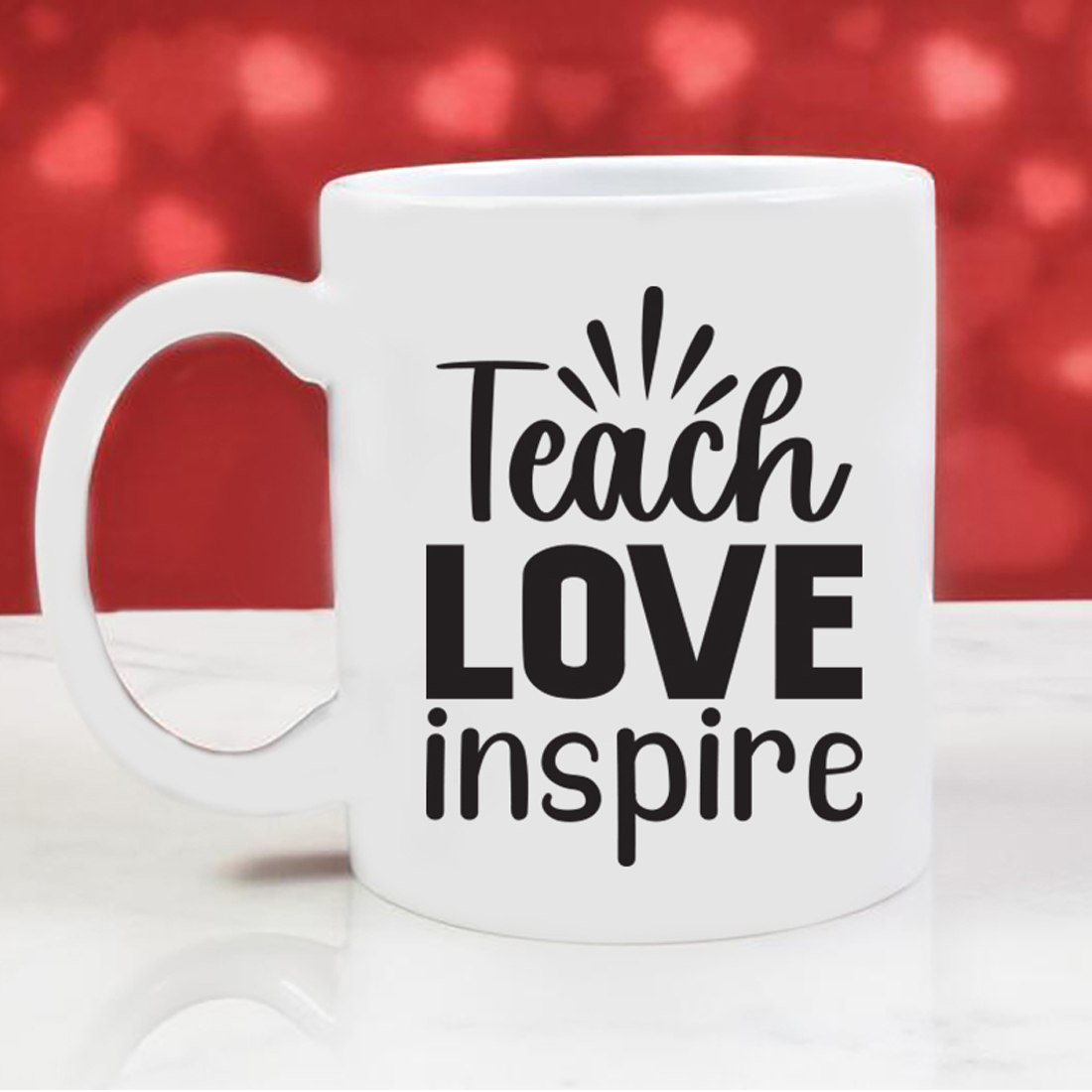 Image of a cup with a unique inscription Teach Love Inspire