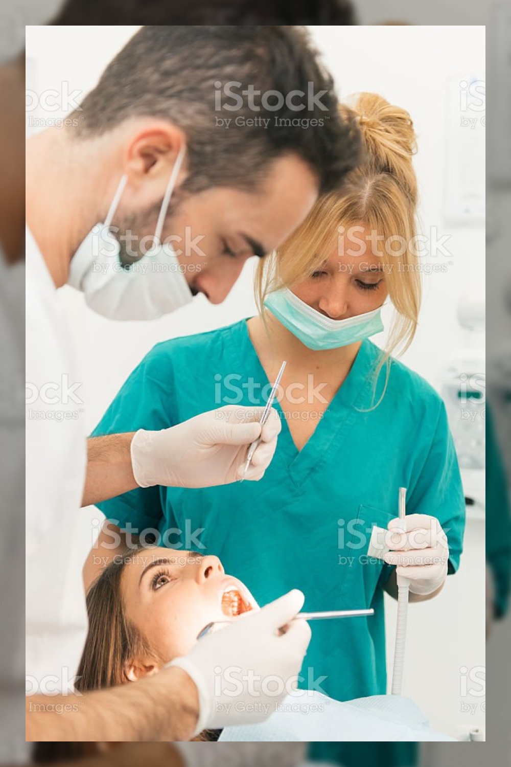 Doctor and the assistant during a surgery stock image stock photo.