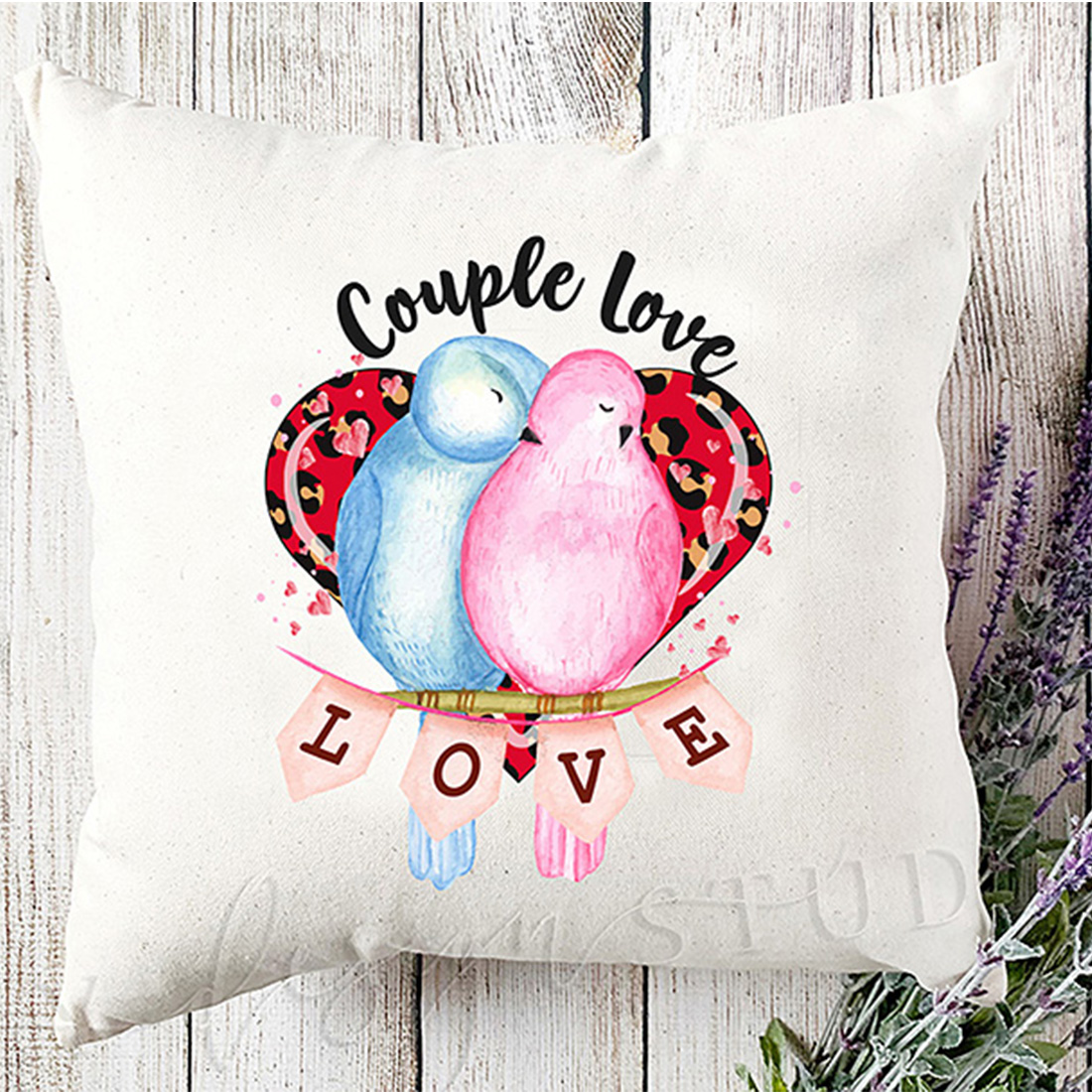 Picture of a pillow with a wonderful print of a couple of birds